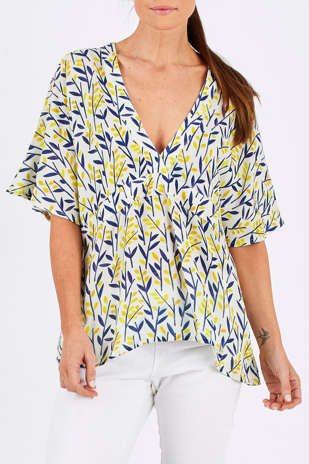Model Monique wearing size 10 of the Tystnad Blouse in colour YellowPtl, from the front, cropped image