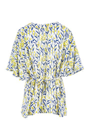 Product shot of the Tystnad Blouse in colour YellowPtl, from the back