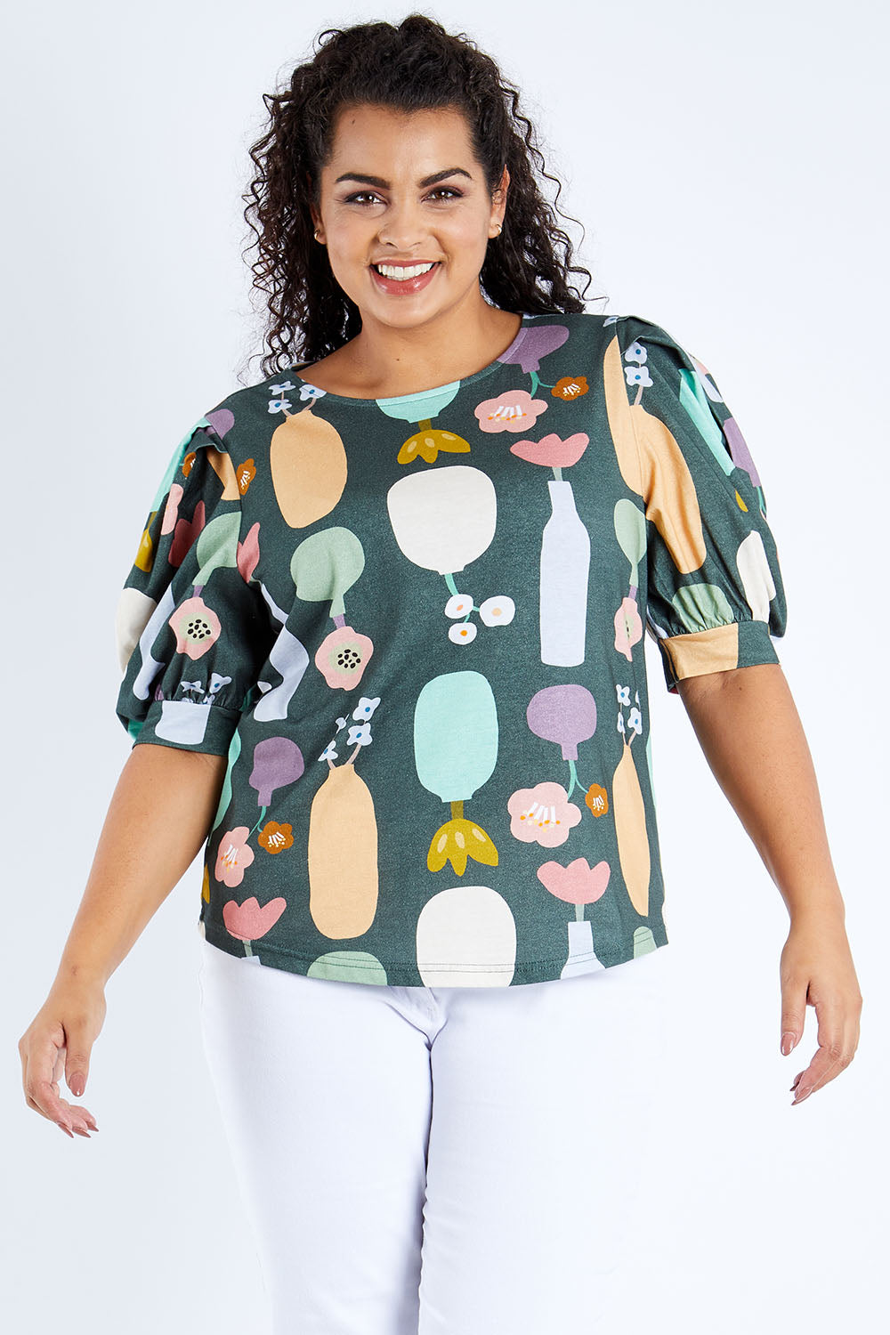 Model Sasha-Lee wearing size 16 of the Barnslig Puff Sleeve Tee in colour Pottery (Grey), from the front, cropped image
