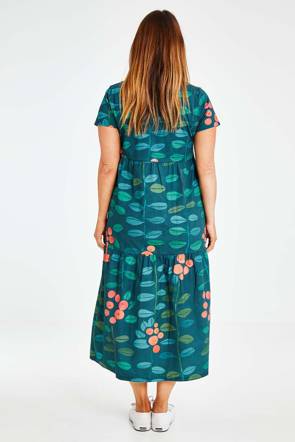 Model Laura wearing size 14 of the Stegs Dress in colour Navjuniper (Blue), from the back