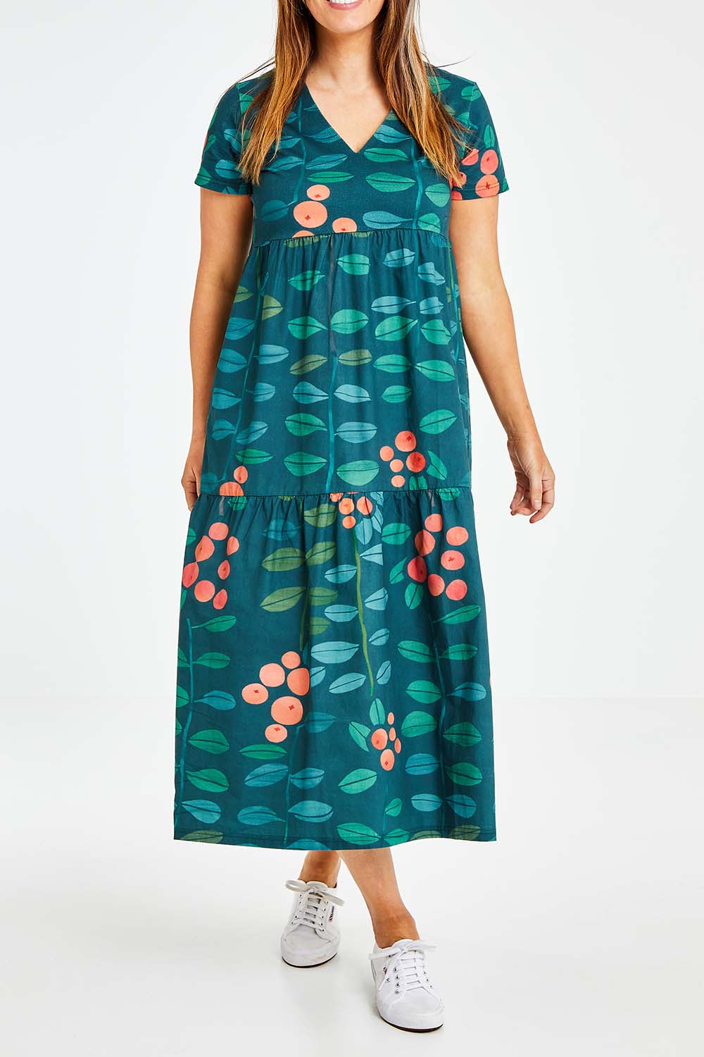Model Laura wearing size 14 of the Stegs Dress in colour Navjuniper (Blue), from the front, cropped image