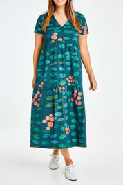 Model Laura wearing size 14 of the Stegs Dress in colour Navjuniper (Blue), from the front, cropped image
