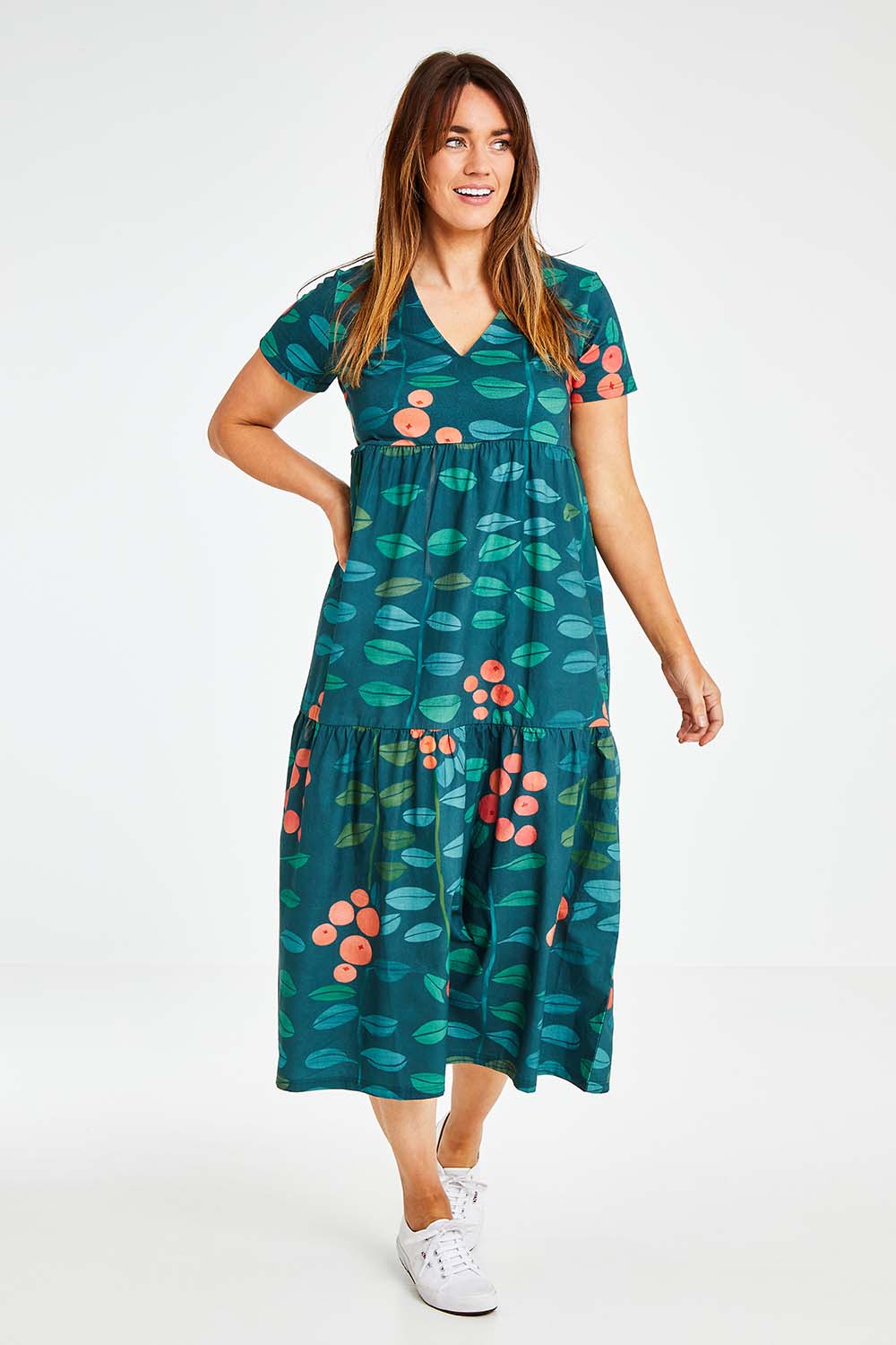 Model Laura wearing size 14 of the Stegs Dress in colour Navjuniper (Blue), from the front, showing the whole outfit