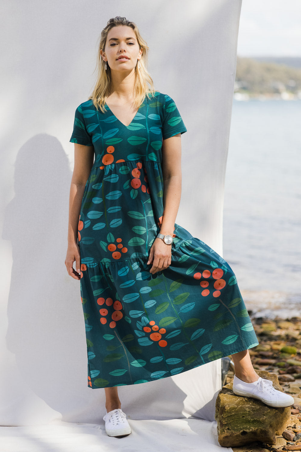 Model Phoebe wearing size 10 of the Stegs Dress in colour Navjuniper (Blue), from the front, showing the whole outfit