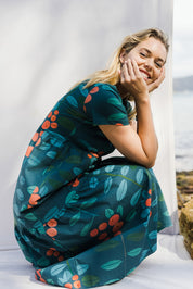 Model Phoebe wearing size 10 of the Stegs Dress in colour Navjuniper (Blue), from the front, showing the whole outfit