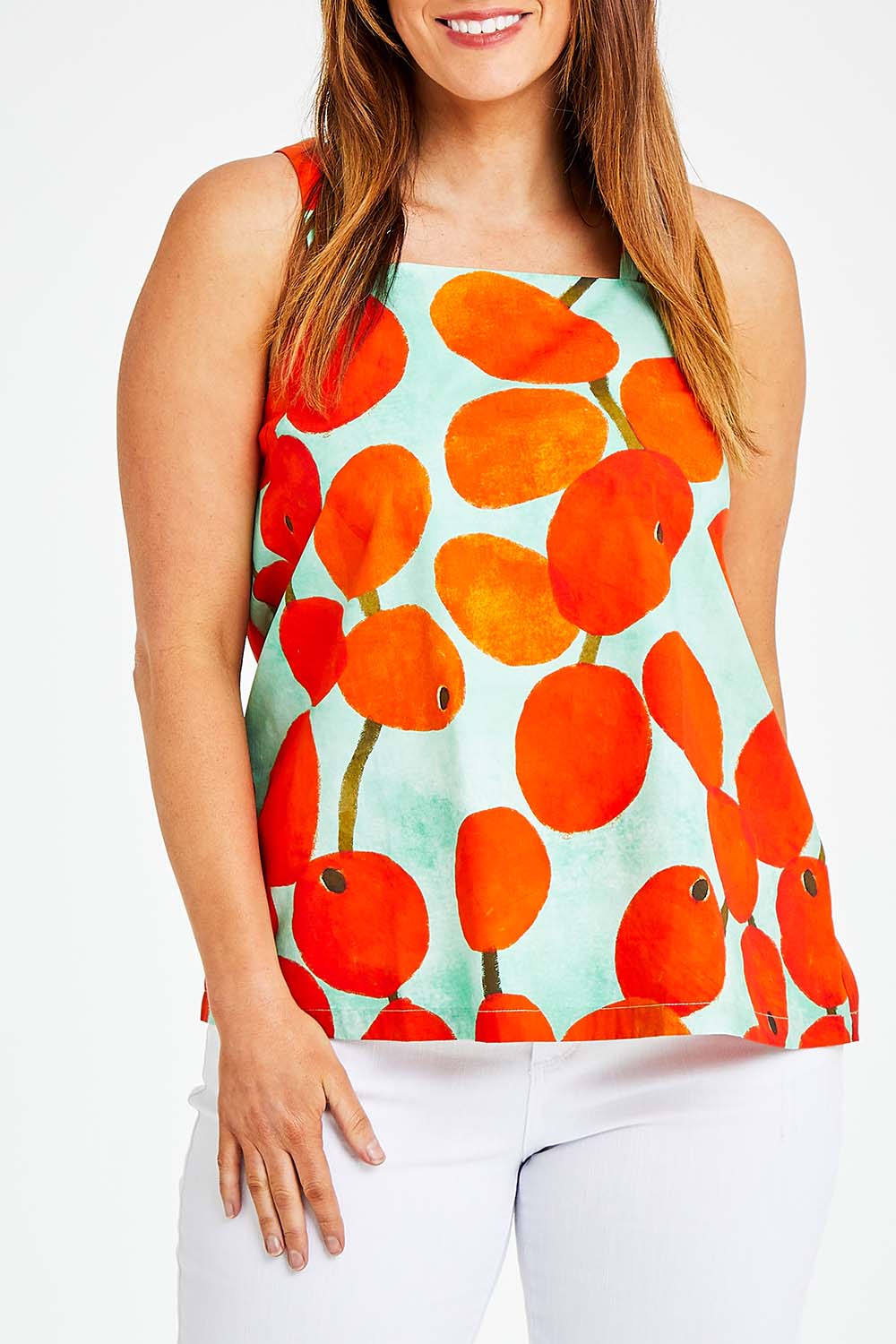 Model Laura wearing size 14 of the Undra Tank in colour Redberry (Red), from the front, cropped image