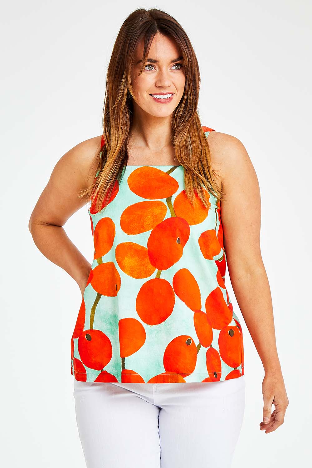 Model Laura wearing size 14 of the Undra Tank in colour Redberry (Red), from the front, cropped image