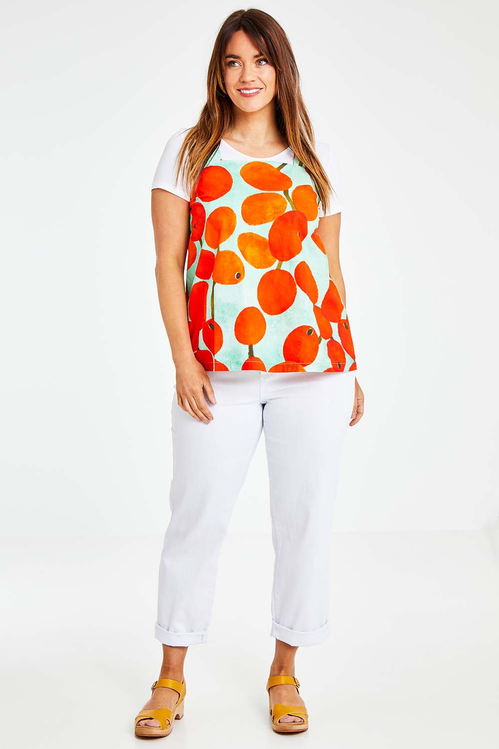 Model Laura wearing size 14 of the Undra Tank in colour Redberry (Red), from the front, showing the whole outfit