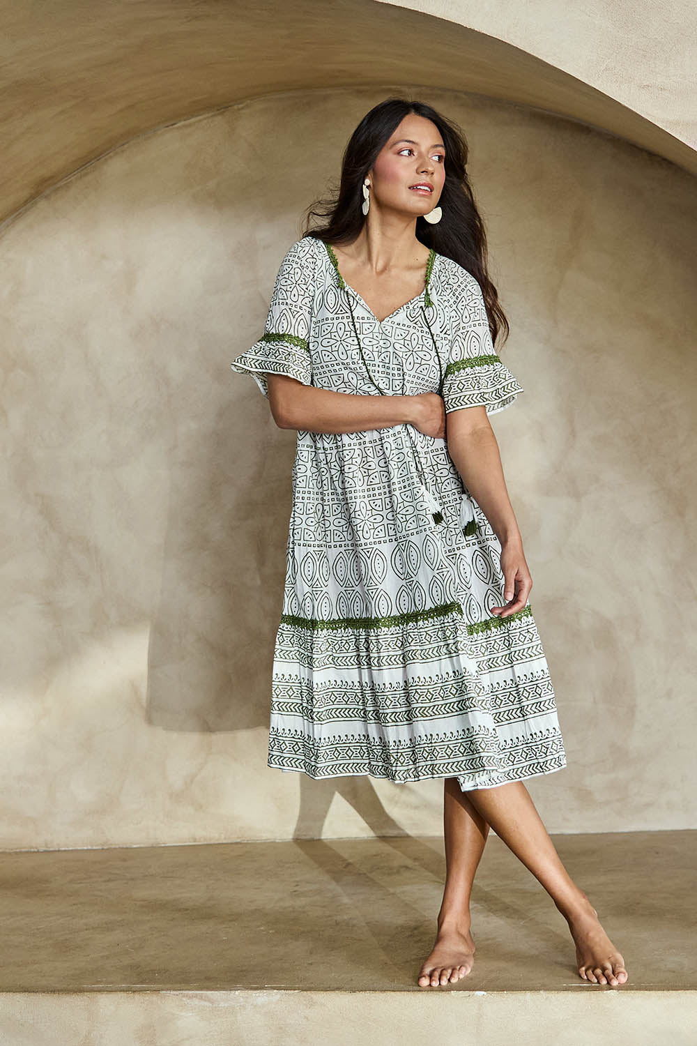 Model Tahneei wearing size 10 of the Cocora Valley Cotton Dress – Olive in colour Olive, from the front