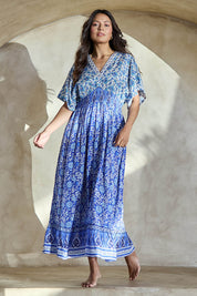 Model Tahneei wearing size 10 of the Pacific Beach Long Dress – Blue in colour Blue, from the front