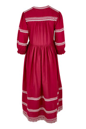 Product shot of the Magdelena River Cotton Dress in colour Rosebud (Pink), from the back