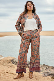 Model Tahnee wearing size 10 of the Adelong Falls Corduroy Pant in colour Ornate, from the front, showing the whole outfit