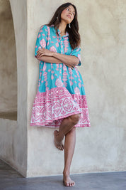 Model Tahneei wearing size 10 of the Wineglass Bay Cotton Dress – Bluepink in colour Bluepink, from the front