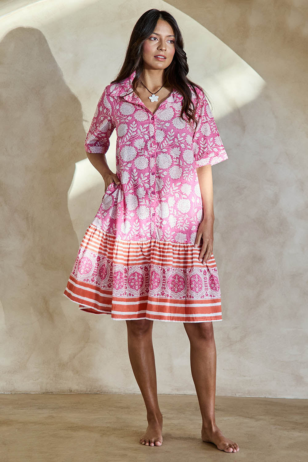 Model Tahneei wearing size 10 of the Wineglass Bay Cotton Dress – Pinkorange in colour Pinkorange, from the front