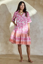 Model Tahneei wearing size 10 of the Wineglass Bay Cotton Dress – Pinkorange in colour Pinkorange, from the front
