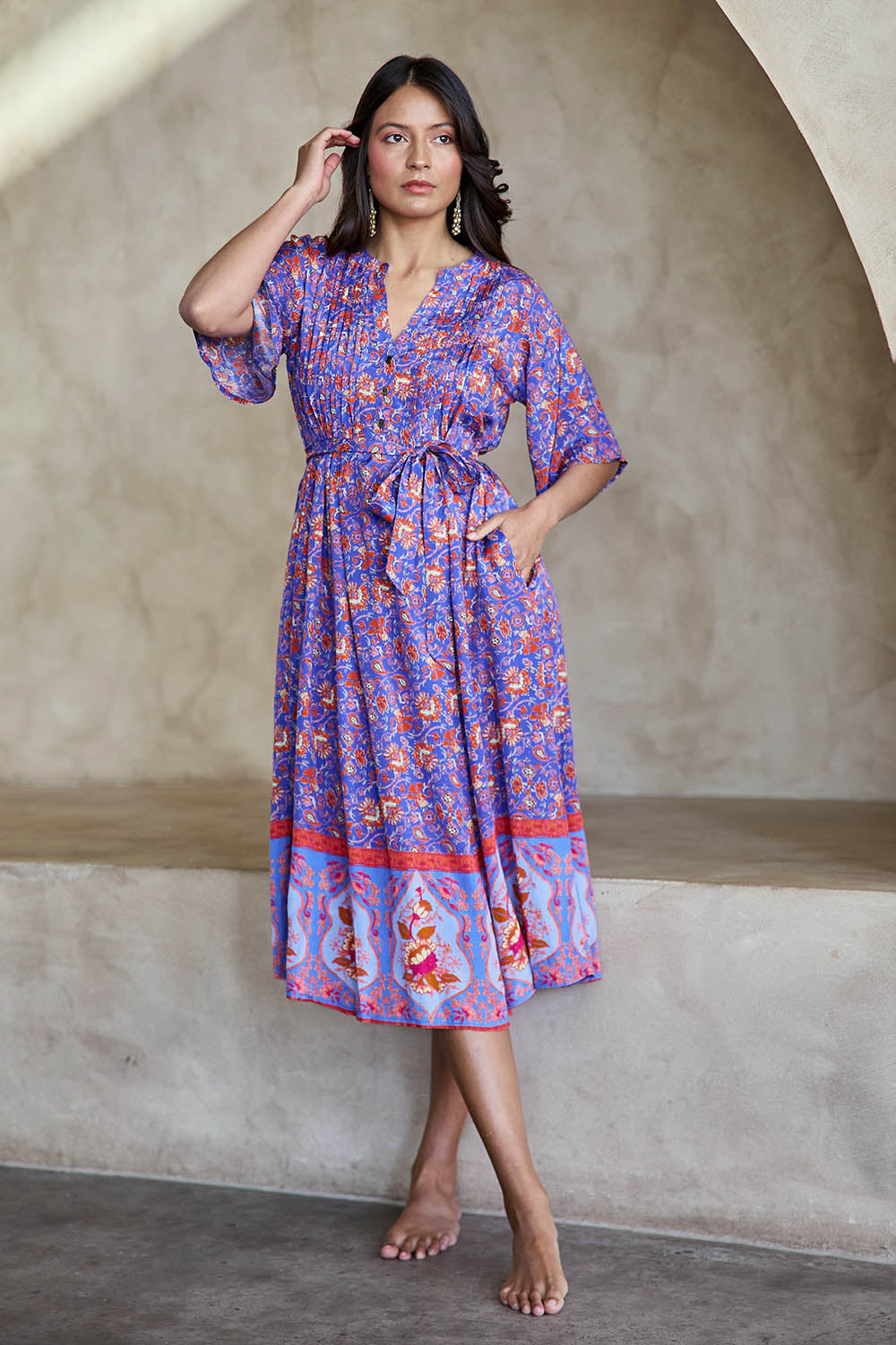 Model Tahneei wearing size 10 of the Turquoise Bay Dress – Rose in colour Rose, from the front