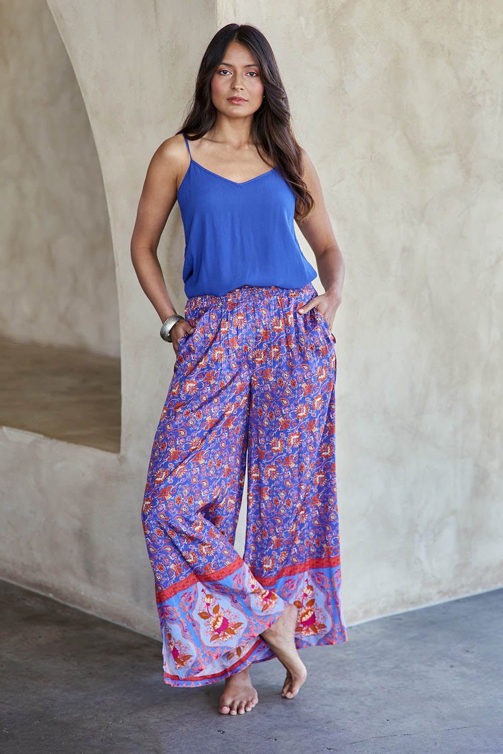 Model Tahneei wearing size 10 of the Turquoise Bay Pant – Rose in colour Rose, from the front