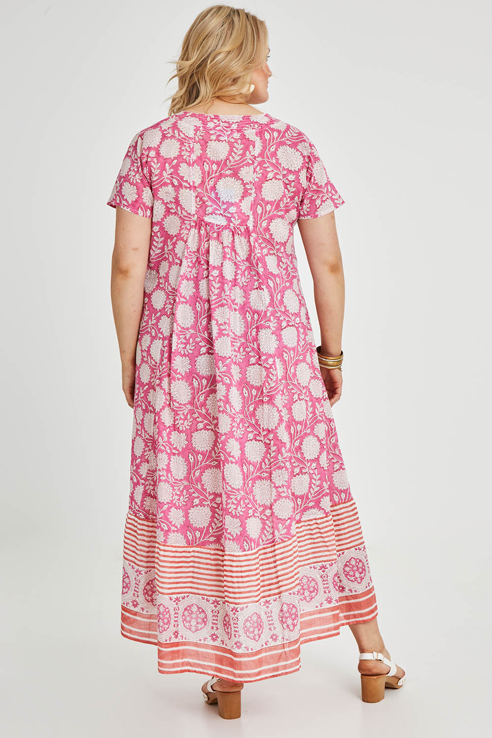 Model Keeara wearing size 16 of the Kurrawa Beach Long Cotton Dress in colour Pinkorange (Pink), from the back