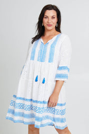 Model Poppy wearing size 16 of the Bondi Beach Dress in colour Blue (Blue), from the front, cropped image