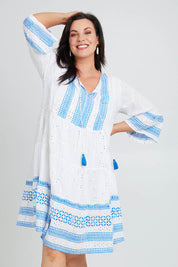 Model Poppy wearing size 16 of the Bondi Beach Dress in colour Blue (Blue), from the front, cropped image