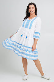 Model Poppy wearing size 16 of the Bondi Beach Dress in colour Blue (Blue), from the front, showing the whole outfit