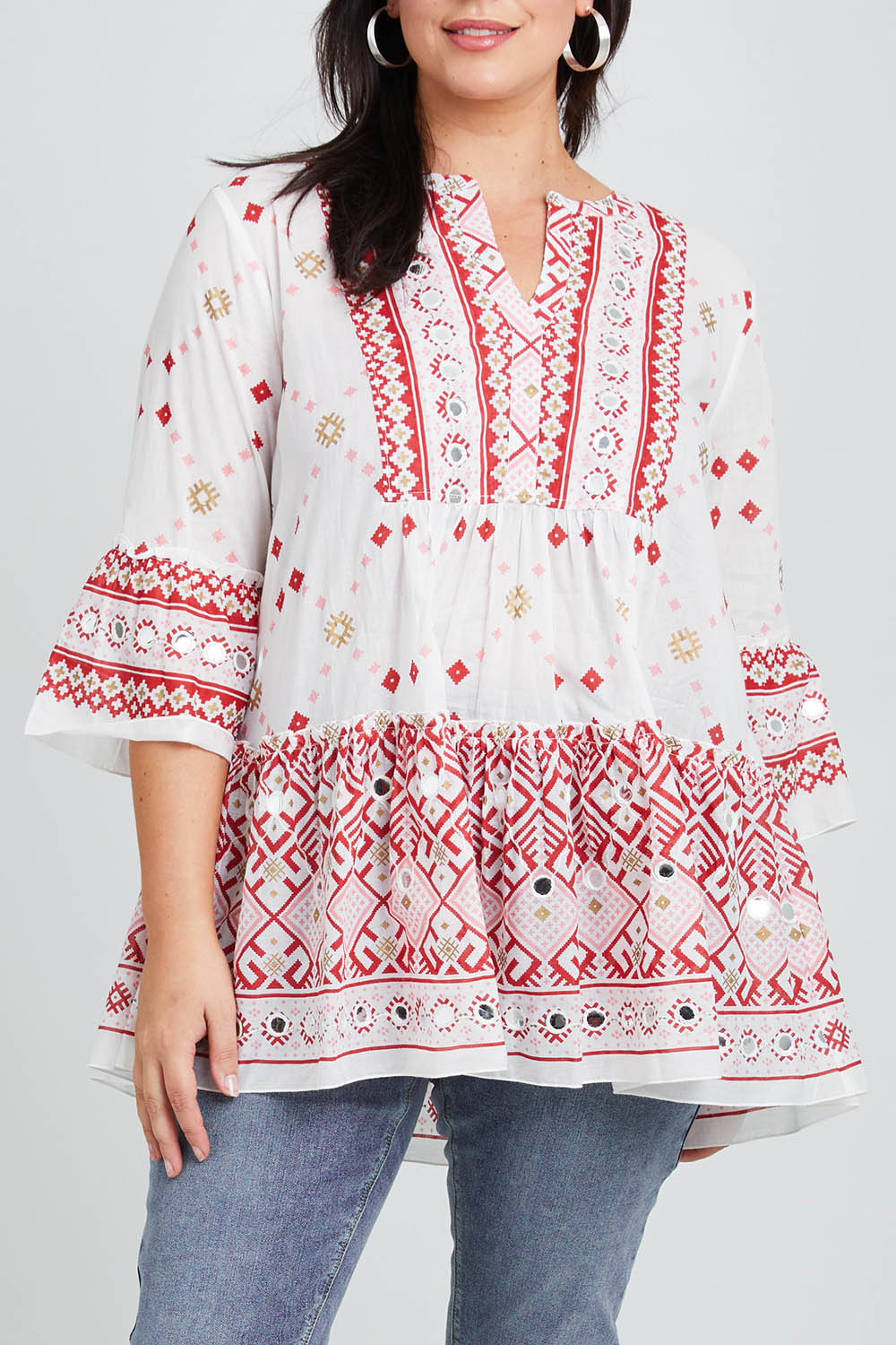 Model Poppy wearing size 16 of the Avalon Beach Blouse in colour Pinkred (Pink), from the front, cropped image