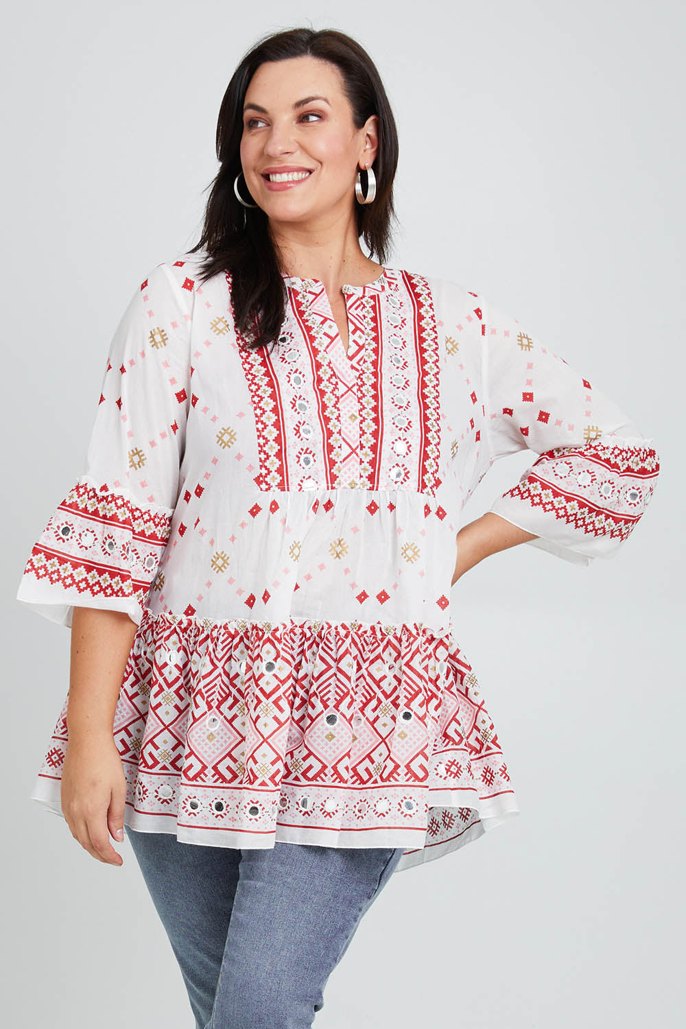 Model Poppy wearing size 16 of the Avalon Beach Blouse in colour Pinkred (Pink), from the front, cropped image