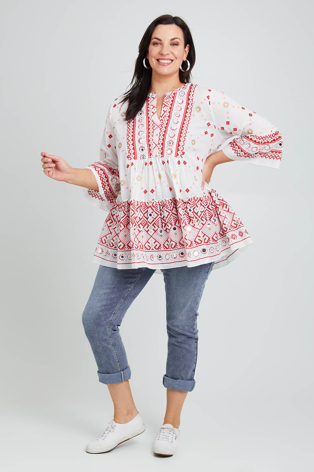 Model Poppy wearing size 16 of the Avalon Beach Blouse in colour Pinkred (Pink), from the front, showing the whole outfit