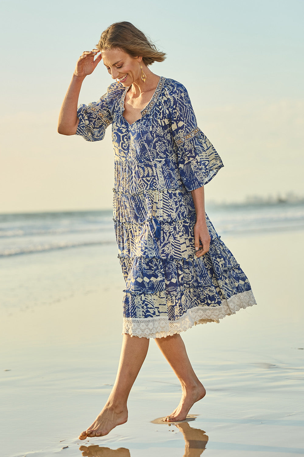 Model Riina wearing size 10 of the Tathra Beach Cotton Dress in colour Blue (Blue), from the front, showing the whole outfit