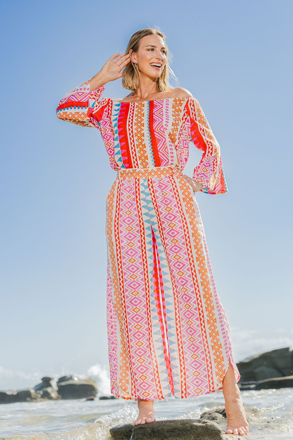 Model Riina wearing size 10 of the Moon Bay Cotton Pants in colour Multipink (Pink), from the front, showing the whole outfit