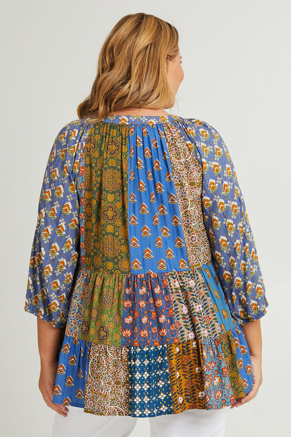 Model Fiona wearing size 16 of the Brighton Beach Top in colour Patchblue (Blue), from the back