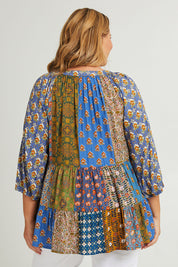 Model Fiona wearing size 16 of the Brighton Beach Top in colour Patchblue (Blue), from the back