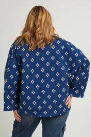 Model Fiona wearing size 16 of the Nightcliff Beach Jacket in colour Navy (Blue), from the back