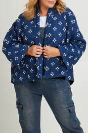 Model Fiona wearing size 16 of the Nightcliff Beach Jacket in colour Navy (Blue), from the front, cropped image