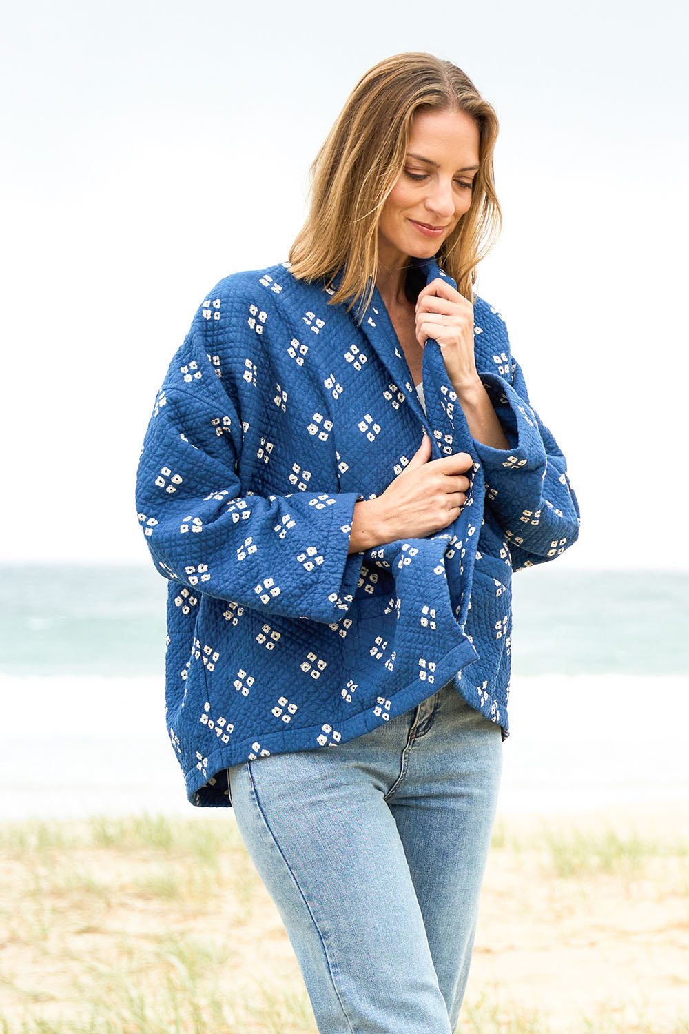 Model Riina wearing size 10 of the Nightcliff Beach Jacket in colour Navy (Blue), from the front, showing the whole outfit