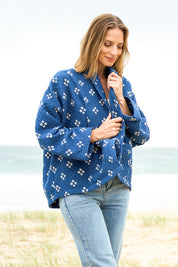 Model Riina wearing size 10 of the Nightcliff Beach Jacket in colour Navy (Blue), from the front, showing the whole outfit
