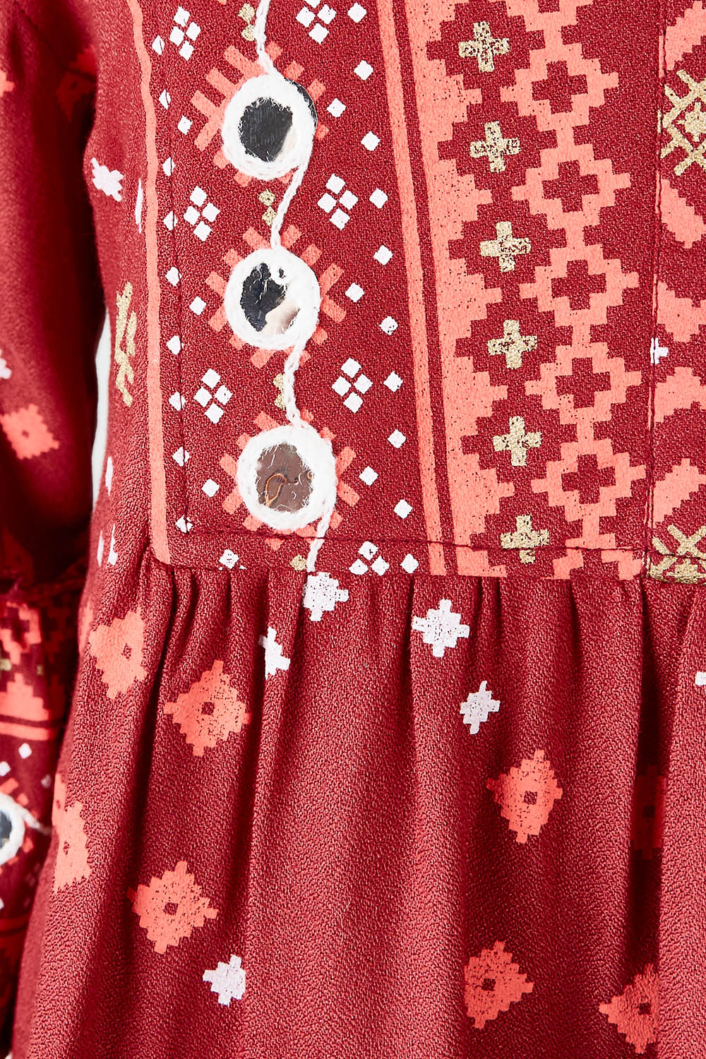 Product shot of the Balmoral Beach Top in colour Rust (Red), detail