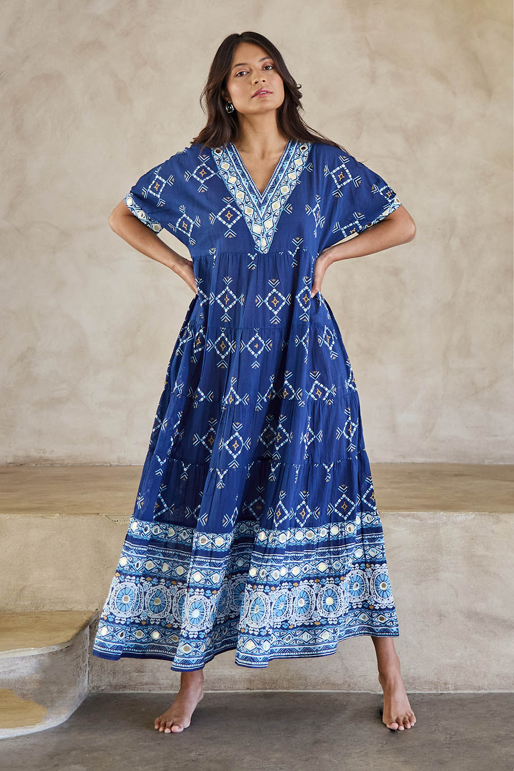 Model Tahneei wearing size 10 of the Dee Why Beach Cotton Maxi Dress – Navy in colour Navy, from the front