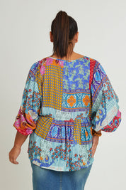 Model Ashleigh wearing size 16 of the Burleigh Beach Top in colour Patchmulti, from the back