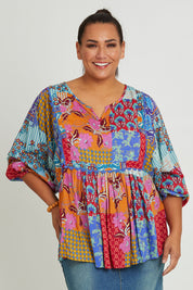 Model Ashleigh wearing size 16 of the Burleigh Beach Top in colour Patchmulti, from the front, cropped image