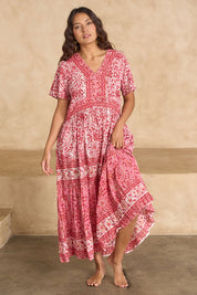 Model Tahnee wearing size 10 of the Cottesloe Beach Cotton Maxi Dress in colour Pinkfloral (Pink), from the front, showing the whole outfit
