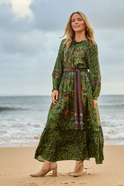 Model Maggie wearing size 10 of the Edith Falls Maxi Dress in colour Aztec (Green), from the front, showing the whole outfit