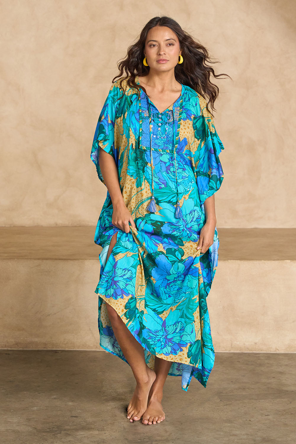 Model Tahnee wearing size 10 of the Blue Lagoon Embroidered Maxi Dress in colour Azurebloom, from the front, showing the whole outfit