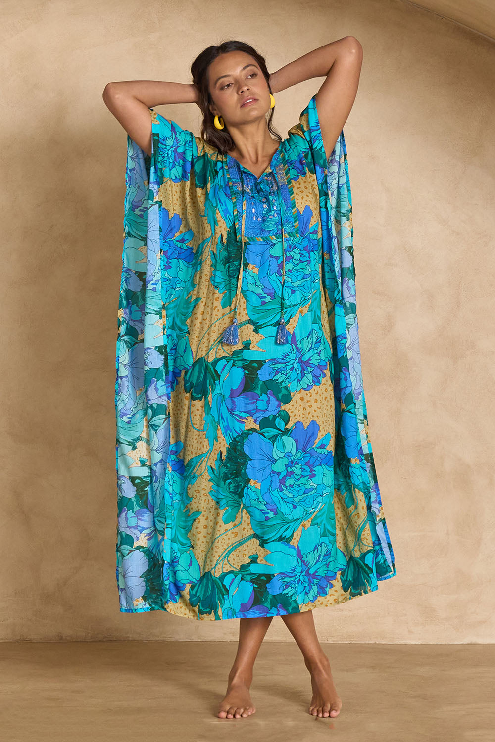 Model Tahnee wearing size 10 of the Blue Lagoon Embroidered Maxi Dress in colour Azurebloom, from the front, showing the whole outfit