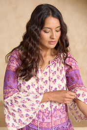 Model Tahnee wearing size 10 of the Angel Falls Dress in colour Pink (Pink), from the front, showing the whole outfit