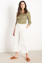 A model wearing the Larissa Shirt in colour Spotcutstm (White), from the front, showing the whole outfit
