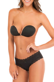 A model wearing the Nudi Bra in colour Black (Black), from the front, cropped image