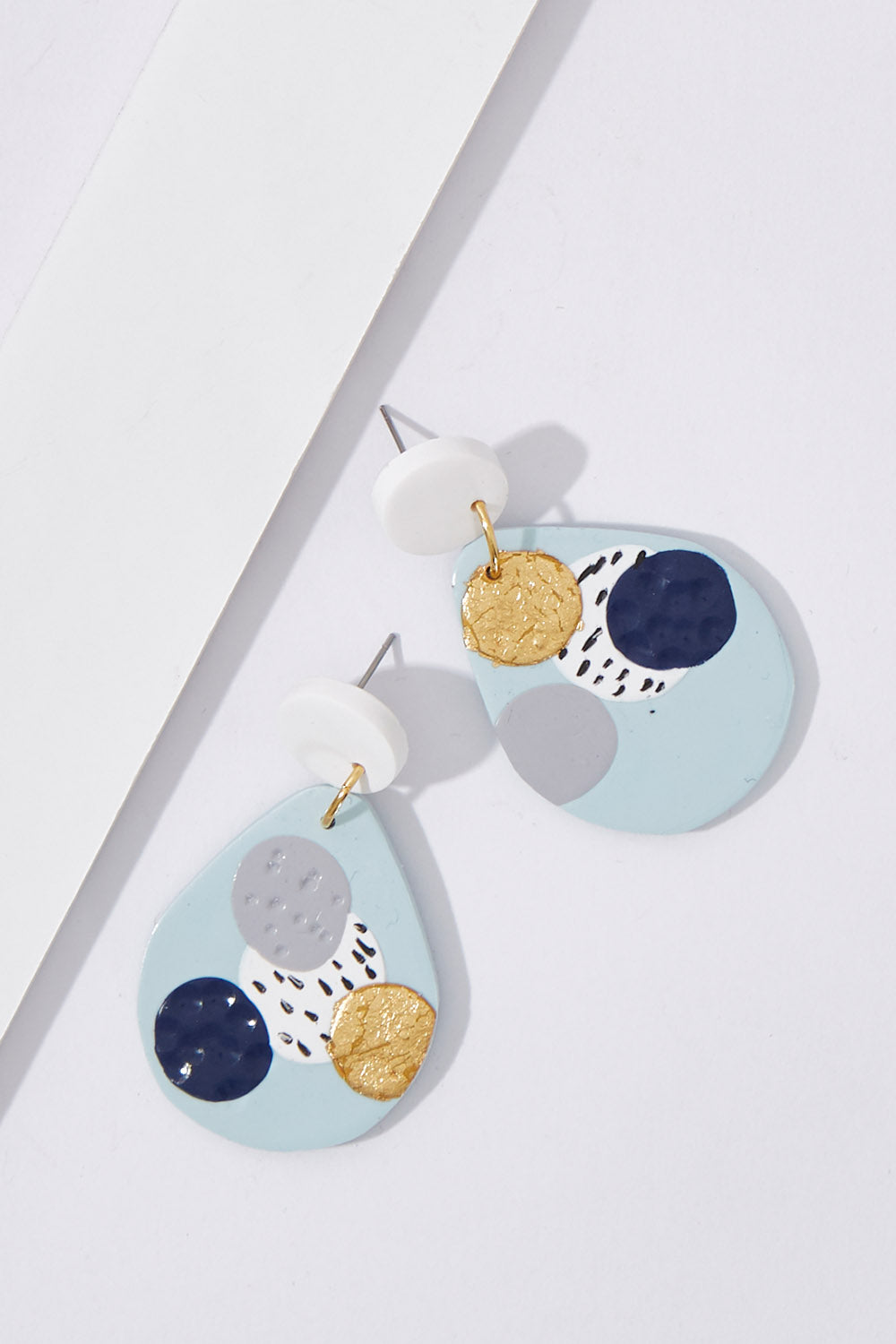A model wearing size OneSize of the Large Dangle Blue Dot Earrings in colour Blue (Blue), from the front, showing the whole outfit