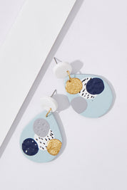 A model wearing size OneSize of the Large Dangle Blue Dot Earrings in colour Blue (Blue), from the front, showing the whole outfit