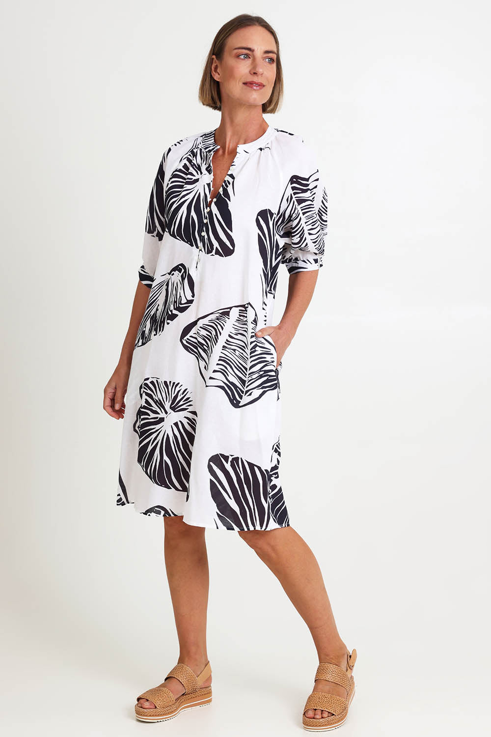 Model Riinar wearing size 10 of the Shell Button Front Dress – Shell in colour Shell, from the front